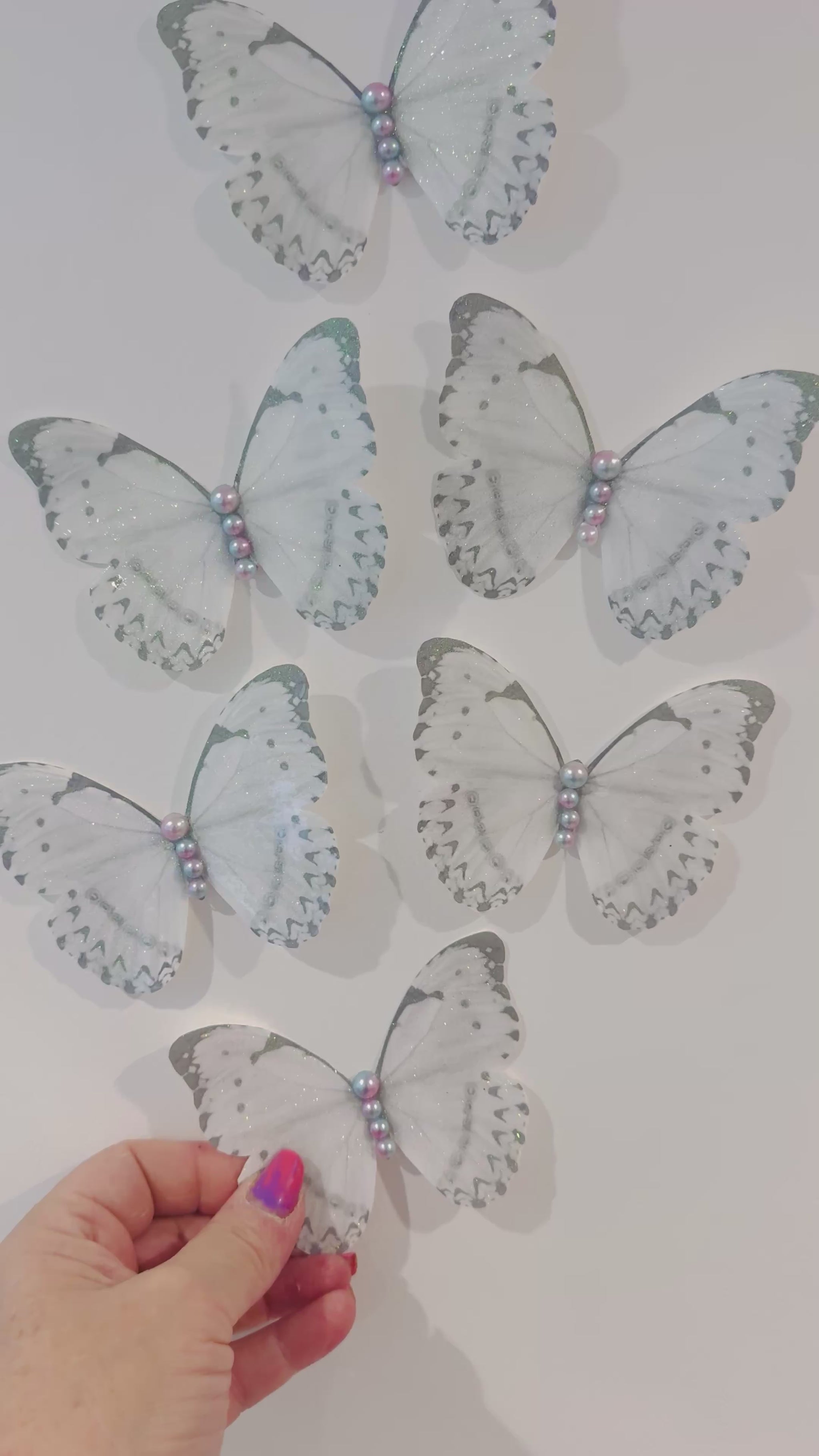 white sparkly butterfly wall decor