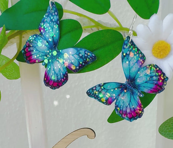 Turquoise  and pink  butterfly  drop earrings. handmade from soda cans