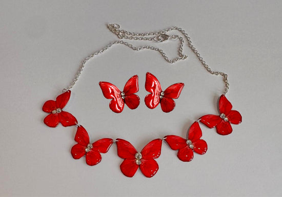 red butterfly triple necklace and earrings