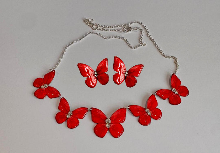 red butterfly triple necklace and earrings