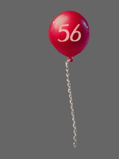 Red balloon with the age umber 56 on it